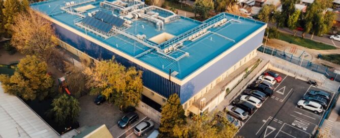 Green metal roof on a modern medical building.