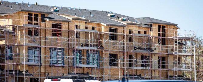 apartment construction shows one of the roofing types of California apartment buildings.